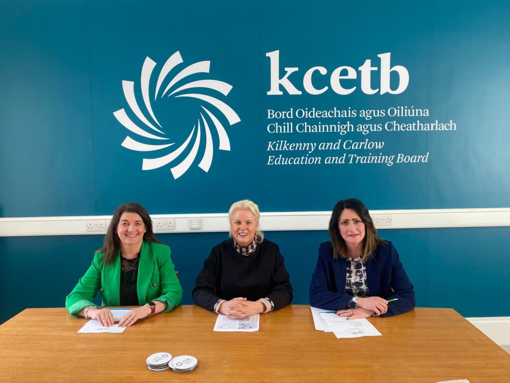 Three people sitting at table