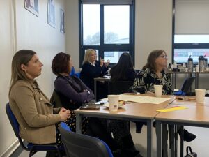 Contributors seated around table
