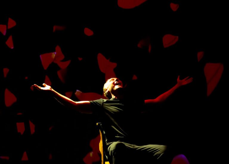 man performs on chair